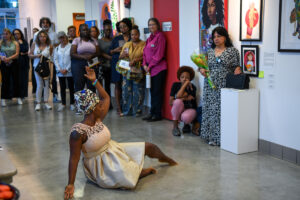 woman posing around group of people