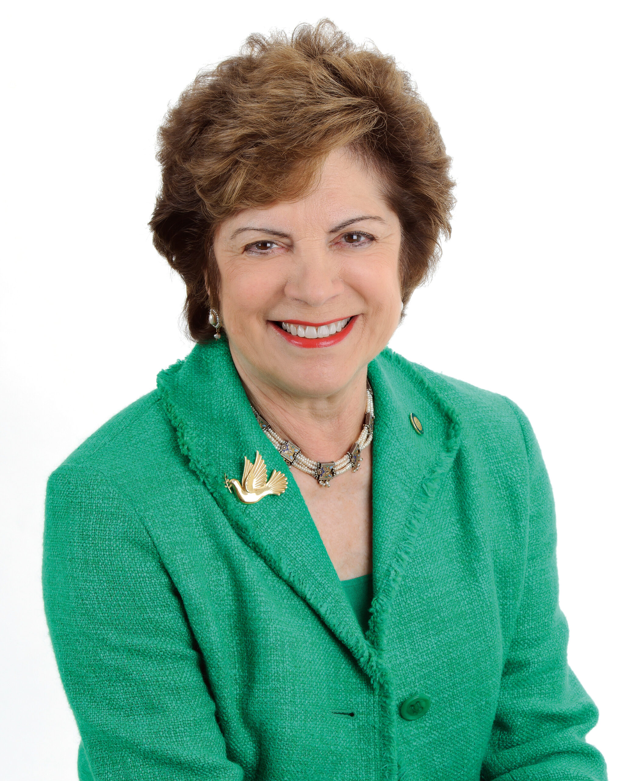 Professional Head-Shot of Senator Nan Rich wearing a green suit